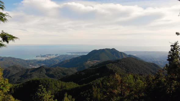 Aerial drone, forested hills near the coast, Kumano Kodo Japan