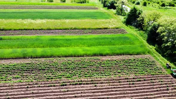 Aerial drone view of a flying over the rural agricultural landscape.