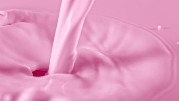 Super Slow Motion Shot of Pouring and Splashing Strawberry Milk at 1000Fps