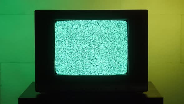 Old Retro Square Television on Green and Yellow Neon Background Screen with Ripples and Interference