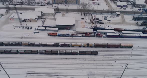 Sovetskiy city. Railway station and the trains.  Aerial. Winter, snow 08