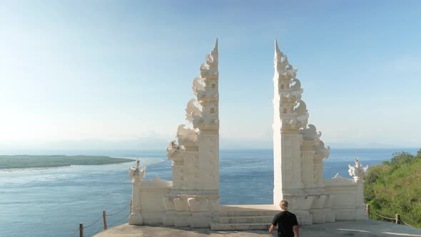 Man in Kilt Walk and Stays in Balinesse Hindu Gate