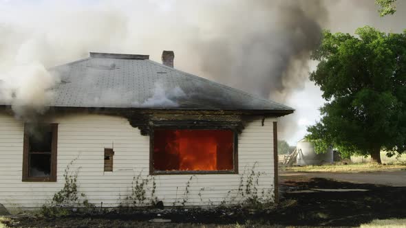 House on fire burning in slow motion