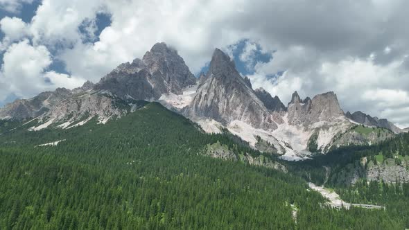 Hikers and travelers enjoy the beautiful mountain views as they have a walk in the Dolomites