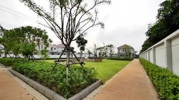 Modern Park With Green Grass and Brick Jogging Track