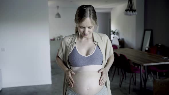 Beautiful Pregnant Woman Touching Belly