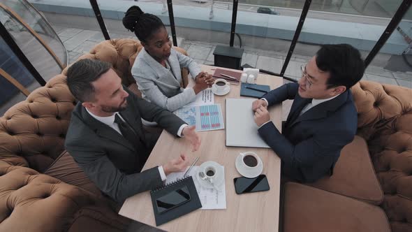 Business Partners in Rooftop Cafe