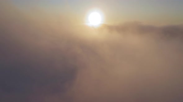  of Flying Back Through Beautiful Golden Sunny Cloudscape at Sunrise