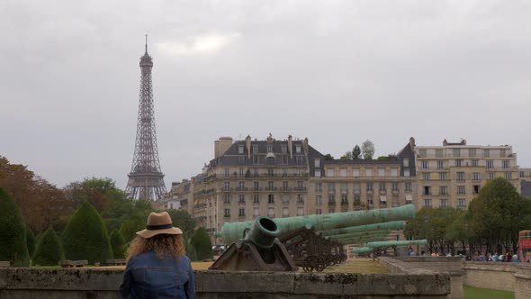 Paris view with Eiffel Tower and old cannons near Les Invalides, France