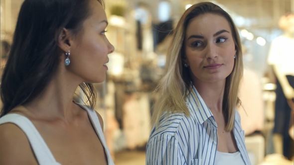 Friendly Shoppers Spending Their Time Together Making Purchases