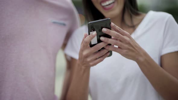 Cropped Shot of Young Woman Using Smartphone