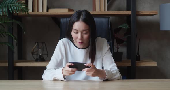 Young Asian Woman Using a Smart Phone