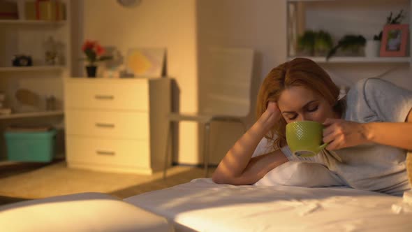 Relaxed Happy Woman Drinking Coffee Lying in Bed, Rest on Weekend Morning, Peace