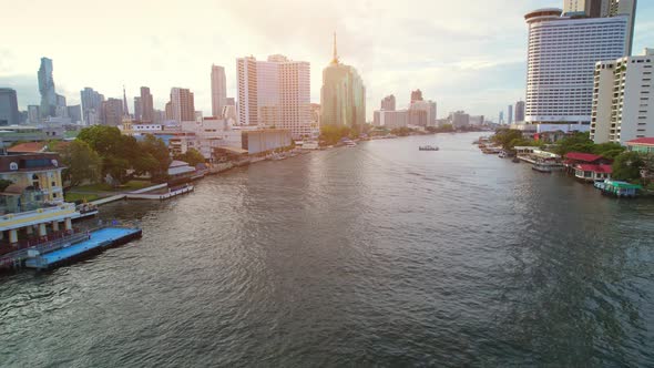 4K : Drones fly over the Chao Phraya River, buildings and business districts