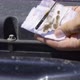 Auto Mechanic Removes the Oil Dipstick From the Engine and Wipes It with a White Cloth - VideoHive Item for Sale