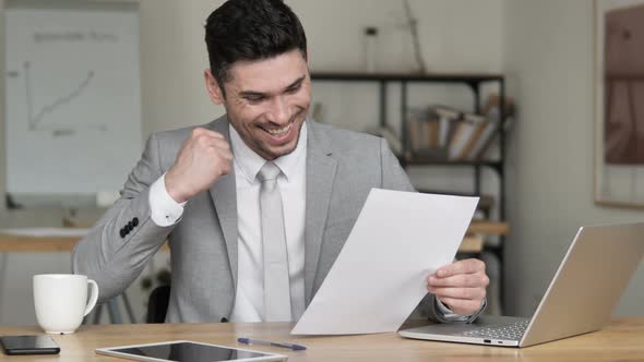 Excited Businessman Celebrating New Contract