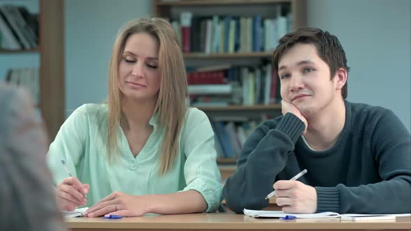 Young Teenage Pupils in Class, Listening To a Teacher