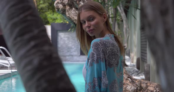 Sexy Lady Posing Around the Pool, Fixing Her Hair and Wears Swimsuit and Tunic