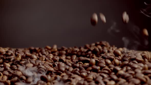 Fragrant Coffee Seeds Falling Down on Pile Closeup