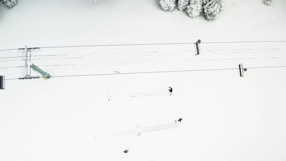 Snow workers shoveling snow in the mountains