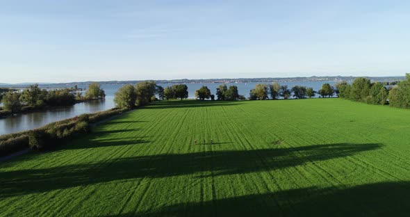 Aerial view of people riding a bike in a field, Lake Constance, Switzerland.