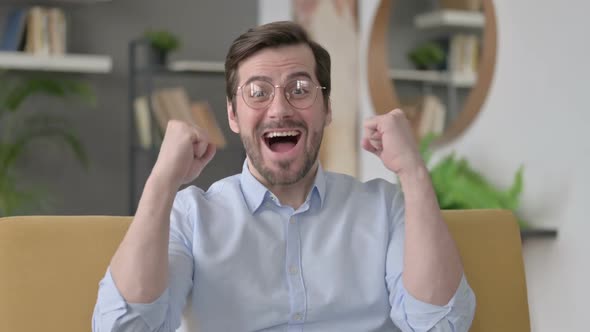 Portrait of Young Man Celebrating Success Winning