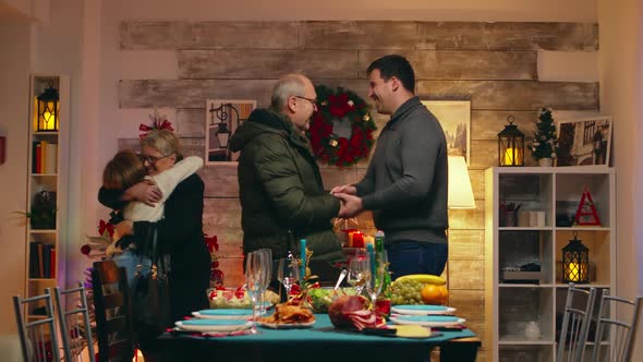 Young Man Shaking Hands with His Father in Law