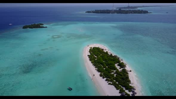 Aerial top down panorama of tropical shore beach break by blue water with white sand background of a