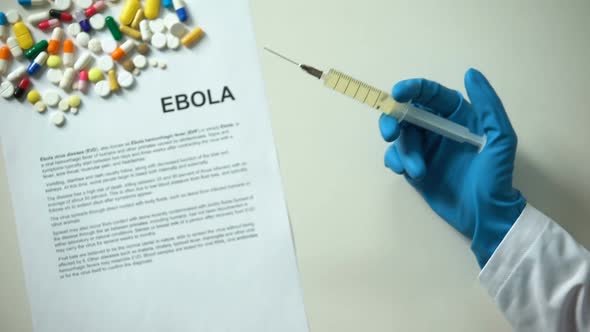 Ebola Diagnosis on Conclusion, Hand Holding Medication in Syringe Treatment
