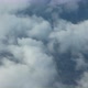 Flying Among Fluffy White Clouds with a View of the Land Below Them - VideoHive Item for Sale