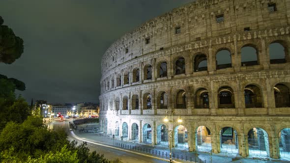 View of Colosseum Illuminated at Night Timelapse Hyperlapse in Rome, Italy