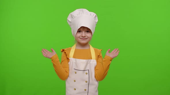 Girl Dressed Like Chef Cook Pointing at Right and Left on Blank Space Place for Advertisement Logo