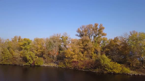 Aerial: Island on Dnipro river in Obolon district of Kiyv, autumn time