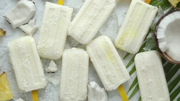 Summer Popsicles on Stick. Pinacolada Flavour. Made with Pineapple, Cocount Milk, Rum. Vegan Snack
