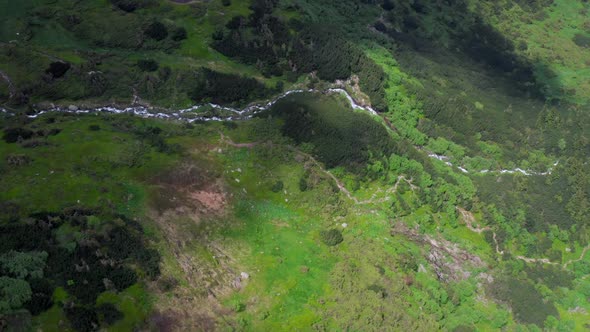 Aerial View Of A Plateau Waterfall High Mountain Range Surrounding