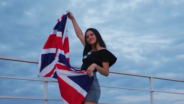 Girl holding the United Kingdom flag