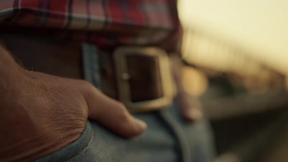 Agronomist Keep Hand Pocket Standing Near Combine at Sunset Field Closeup