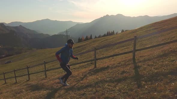 A Marathon Runner Trains Uphill In Altitude