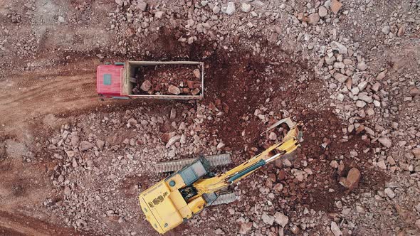 Excavator Fills Dump Truck