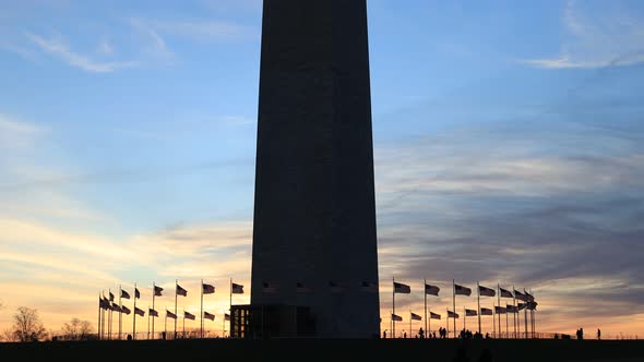 Washington Monument, American flags, tourists - DC - Sunset silhouette