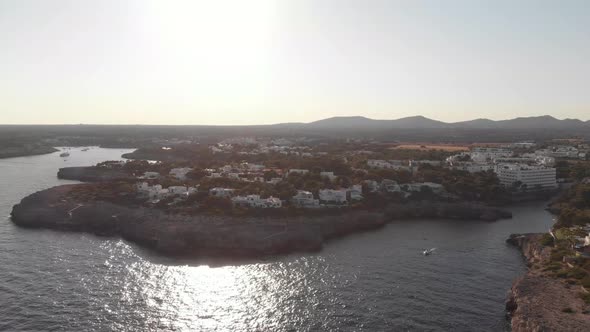 Aerial: Beautiful coastline view and town Cala D'or in Mallorca, Spain