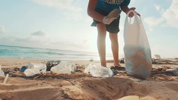 Caucasian Woman Environmental Activist Cleaning Beach From Nondegradable Waste