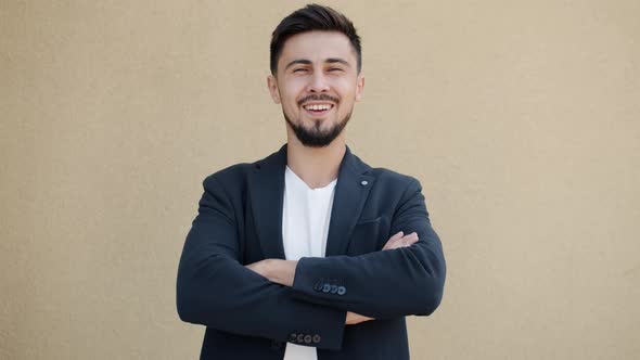 Slow Motion Portrait of Cheerful Businessman Smiling Standing Outdoors with Arms Crossed