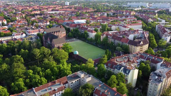 Green soccer field in the middle of the capital of Germany Wonderful aerial view flight rising up d