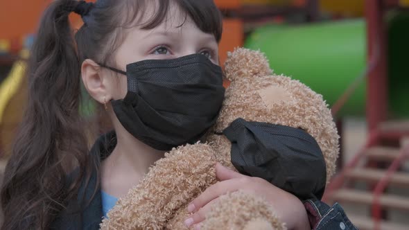 Girl in isolation on playground. 