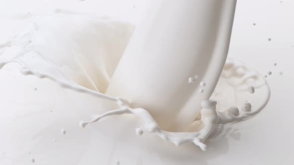 Super Slow Motion Detail Shot of Pouring and Splashing Fresh Cream at 1000 Fps