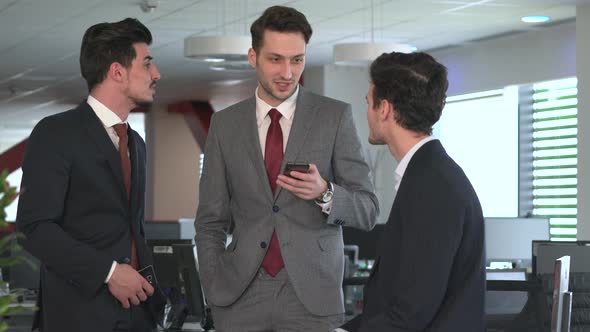 Three businessmen talking