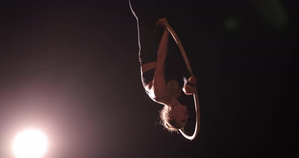 Air Gymnast Woman Perform an Acrobatic Trick