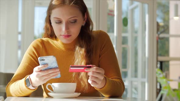 Beautiful Sunny Day Young Woman Drinks Morning Coffee in a Cafe, Making Online a Purchase Easy