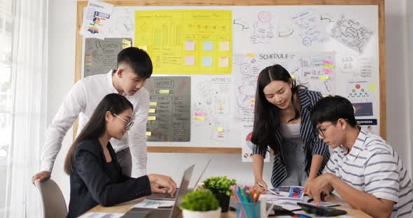 Businesspeople pointing and explaining the information